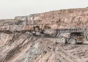 Truck at the open-pit level. Source: Photo by omid roshan on Unsplash.