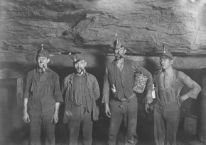 Miners at the begining of XX century in the underground mine. SOurce: Photo by Art Institute of Chicago on Unsplash.