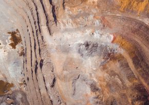 Open-pit mine view from the sky. Photo by Victor on Unsplash