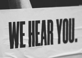 Sign: we hear you. Source: Photo by Jon Tyson on Unsplash