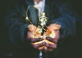 Man holding in hands shinging lighting bulb. Source: Photo by Riccardo Annandale on Unsplash