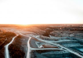 Open-pit mine aerial view. Source: moritz-lange unspash