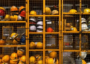 Mining helmets in changing room. Source:Photo by Pop & Zebra on Unsplash